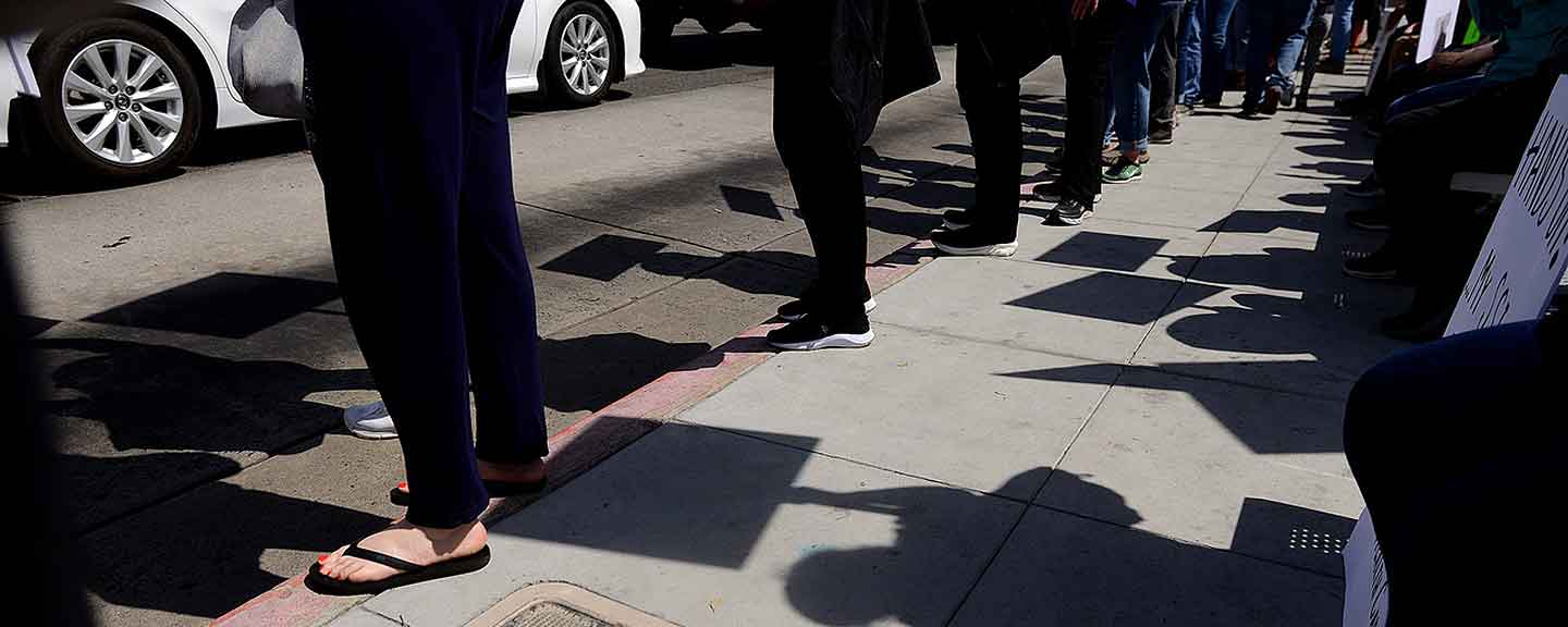 Protesters legs and feet on a street corner